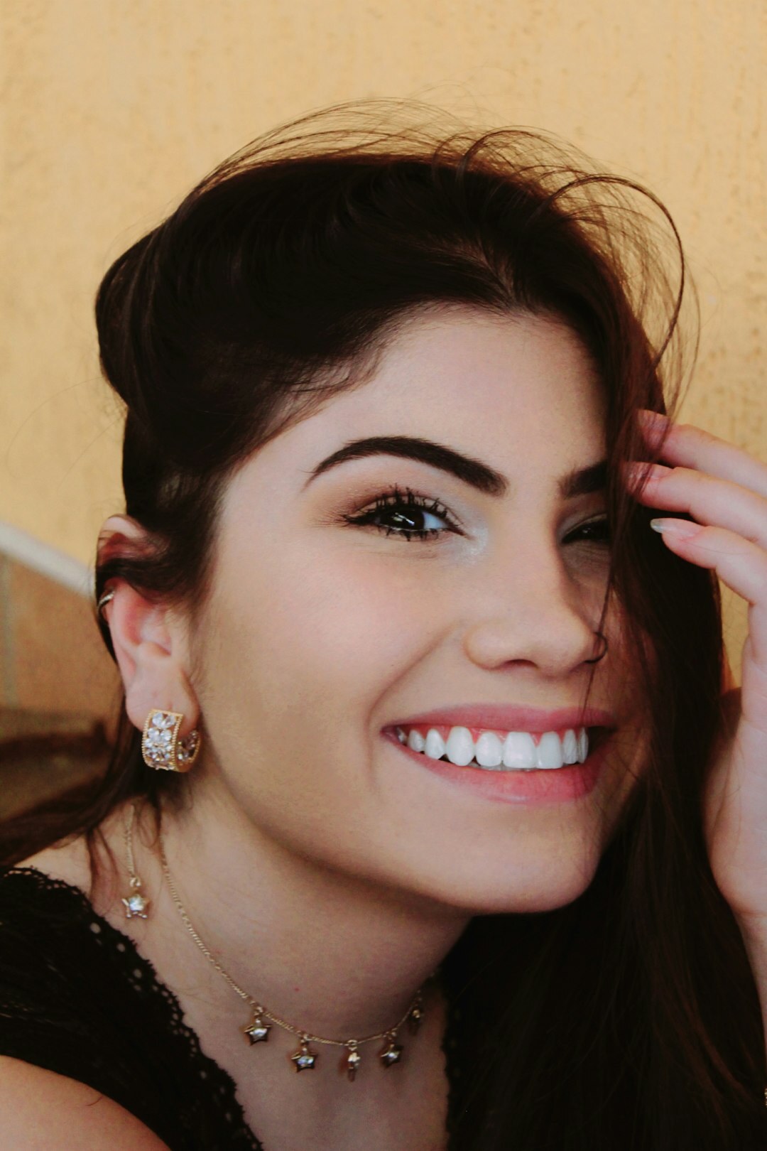 White Brazilian woman speaking warmly during an interview-style photo