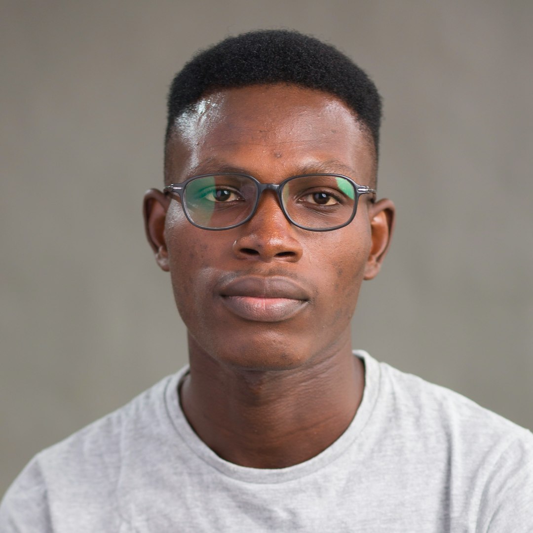 Studio portrait of a Pardo Brazilian man in his 40s with glasses