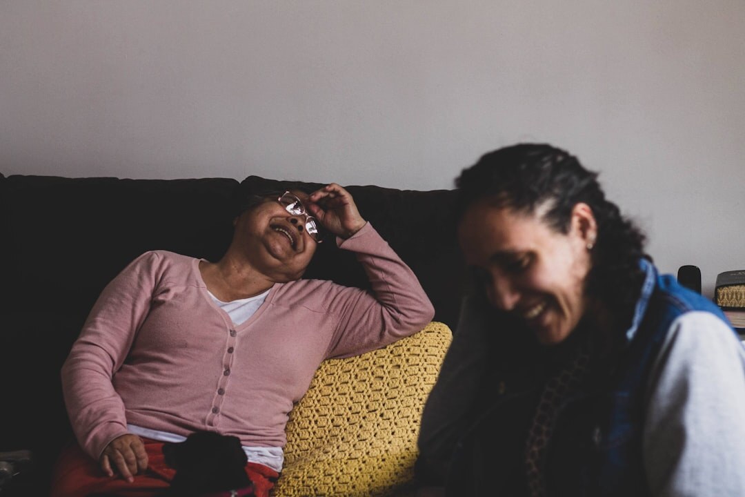 Two Brazilian people having a supportive one-on-one conversation over coffee