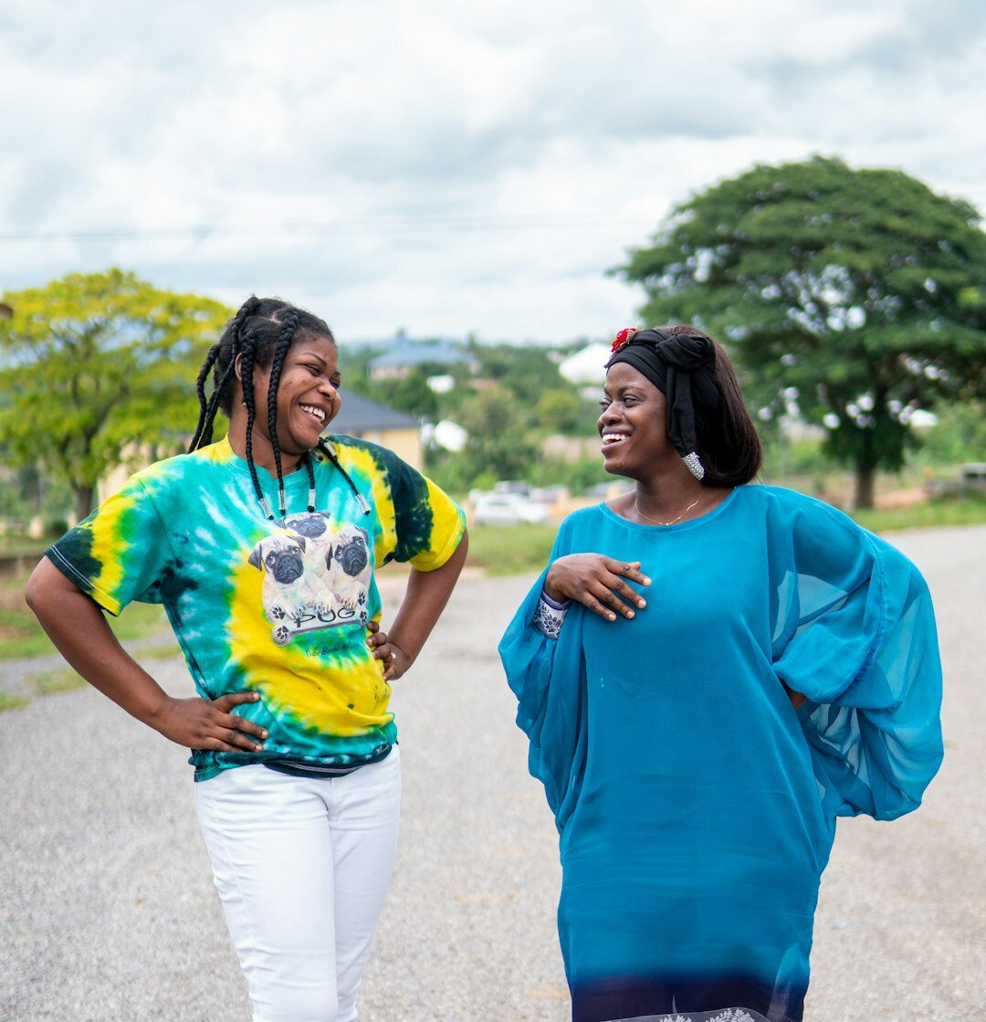 Two Afro-Brazilian women in a warm supportive conversation