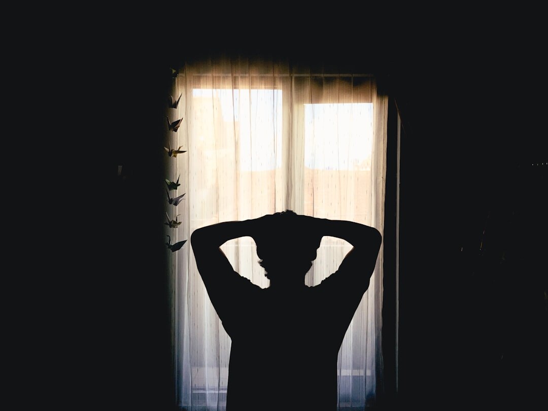 person meditating in quiet room